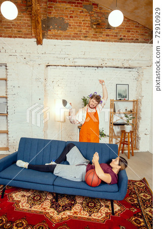 Gender stereotypes. Wife and husband doing things unusual for their genders in social meanings Gender stereotypes. Wife and husband doing things unusual for their genders in social meanings 72910929