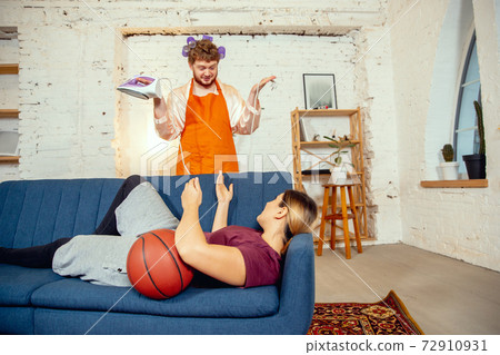 Gender stereotypes. Wife and husband doing things unusual for their genders in social meanings Gender stereotypes. Wife and husband doing things unusual for their genders in social meanings 72910931