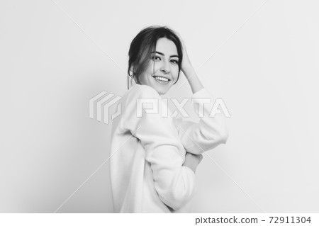 Portrait of beautiful woman isolated on white studio background. Comfort, warm in winter concept Portrait of beautiful woman isolated on white studio background. Comfort, warm in winter concept 72911304