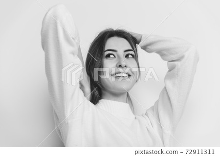Portrait of beautiful woman isolated on white studio background. Comfort, warm in winter concept 72911311