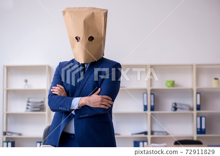 Young male employee with box instead of his head 72911829