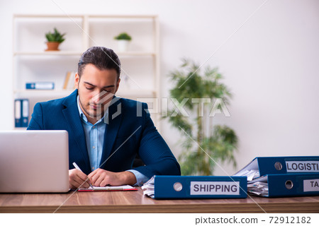 Young male businessman employee working in the office Young male businessman employee working in the office 72912182