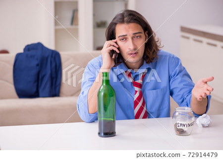 Young male employee being fired from his work at home 72914479