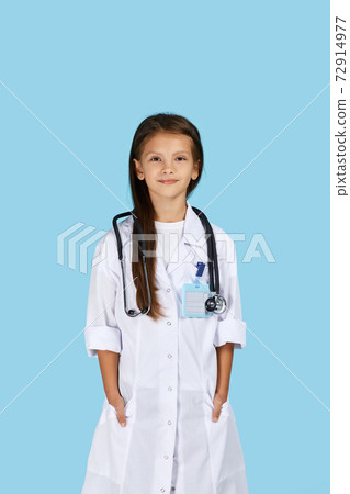 Cute child in doctor coat with stethoscope 72914977