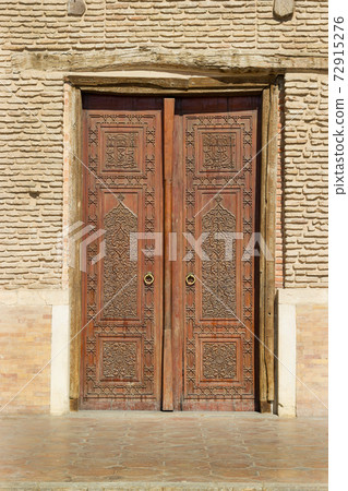 Old carved wooden door from turk castle medieval era. 72915276