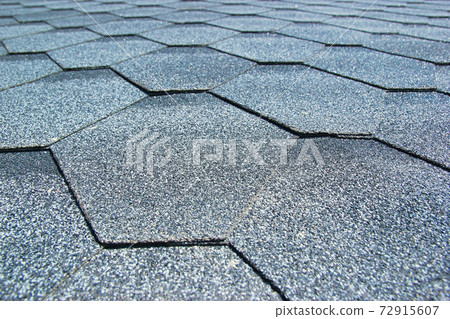 Gray soft roof on the roof of the house. Close-up. Gray soft roof on the roof of the house. Close-up. 72915607