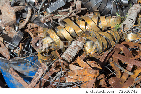 Dump of rusty metal, metal structures and scrap metal texture. Concept non-ferrous scrap metal processing ecology and industry Dump of rusty metal, metal structures and scrap metal texture. Concept non-ferrous scrap metal processing ecology and industry 72916742