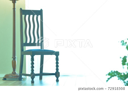 Oak chair on a bright window. With a lamp stand. British antique (clear background, soft focus) Oak chair on a bright window. With a lamp stand. British antique (clear background, soft focus) 72918308