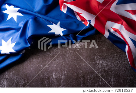 Happy Australia day concept. Australian flag against old stone background. 26 January. 72918527