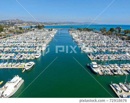 Aerial view of Dana Point Harbor and her marina with yacht and sailboat. 72918676
