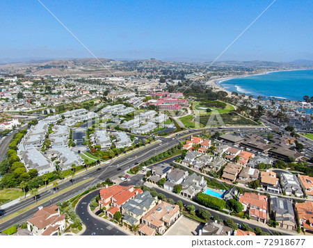 Aerial view of Dana Point Harbor town and beach.  72918677
