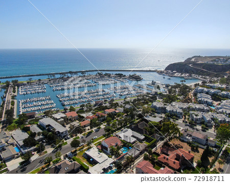 Aerial view of Dana Point Harbor town and beach.  72918711