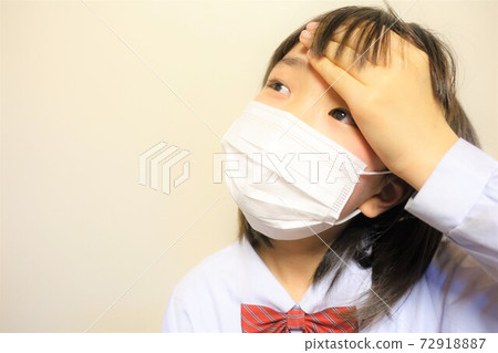 Girl wearing a mask, unwell, coughing, sneezing, fever 72918887