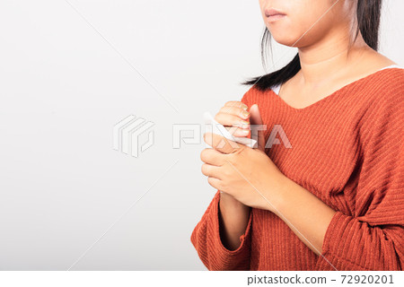 woman she using wet tissue paper wipe cleaning her hands 72920201