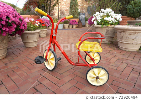 Red yellow children tricycle 72920484