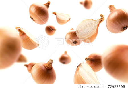 Ripe Golden onion levitates on a white background 72922296