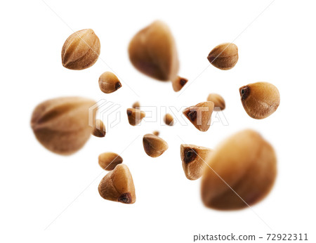 Ripe buckwheat grains levitate on a white background 72922311