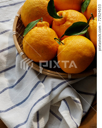 Fresh organic fruit Jeju Hallabong in a basket 72924033
