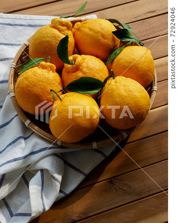 Fresh organic fruit Jeju Hallabong in a basket Fresh organic fruit Jeju Hallabong in a basket 72924046