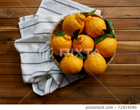 Fresh organic fruit Jeju Hallabong in a basket 72924090