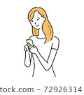 A woman in everyday wear who operates a smartphone 72926314