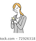 A woman in a suit manipulating a smartphone 72926318