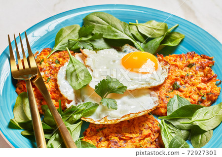 carrots pancakes with Fried Eggs and Greens 72927301