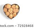 Cookies with nuts in a heart shape box for New Year, Christmas or Valentines Day. Isolate on white background. Top view. Close-up. 72928468