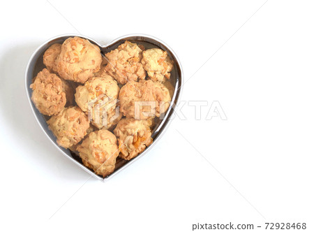 Cookies with nuts in a heart shape box for New Year, Christmas or Valentines Day. Isolate on white background. Top view. Close-up. 72928468