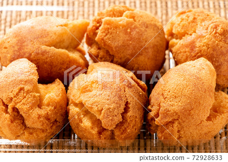 Sata andagi in a takeaway container. Sata andagi in a takeaway container. 72928633
