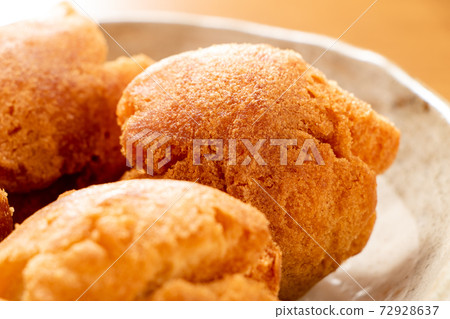 Sata andagi (sweets known as one of Okinawa's specialties). Sata andagi (sweets known as one of Okinawa's specialties). 72928637