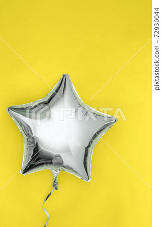 A silver glitter foil star shaped balloon A silver glitter foil star shaped balloon 72930044