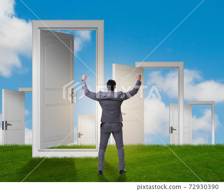 Businessman facing many business opportunities Businessman facing many business opportunities 72930390