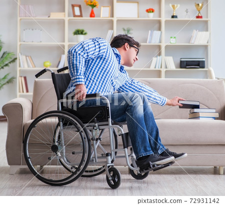 Young student on wheelchair in disability concept 72931142