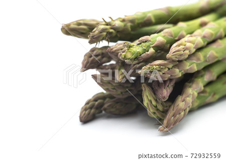 Closeup of organic asparagus on white background Closeup of organic asparagus on white background 72932559
