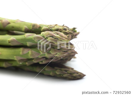 Closeup of organic asparagus on white background Closeup of organic asparagus on white background 72932560