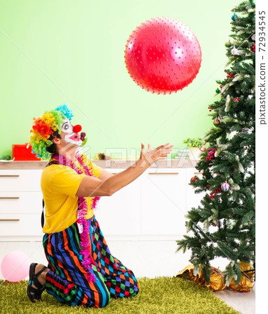 Funny clown in Christmas celebration concept Funny clown in Christmas celebration concept 72934545