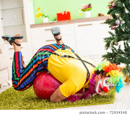 Funny clown in Christmas celebration concept Funny clown in Christmas celebration concept 72934548
