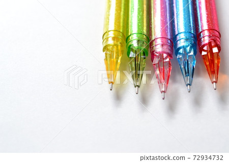 Nib of a colorful ballpoint pen with glitter 72934732