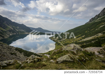 Black Pond Gasienicowy beautiful clean lake in the Polish Tatra Mountains. Black Pond Gasienicowy beautiful clean lake in the Polish Tatra Mountains. 72938734