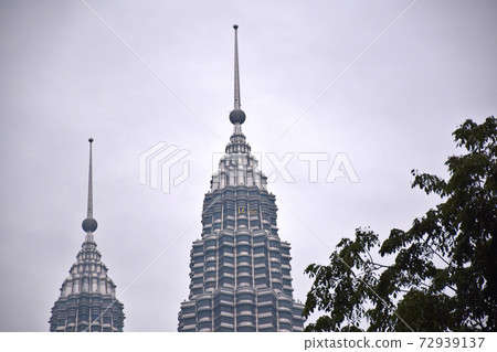 The Petronas Towers, also known as the Petronas Twin Towers The Petronas Towers, also known as the Petronas Twin Towers 72939137