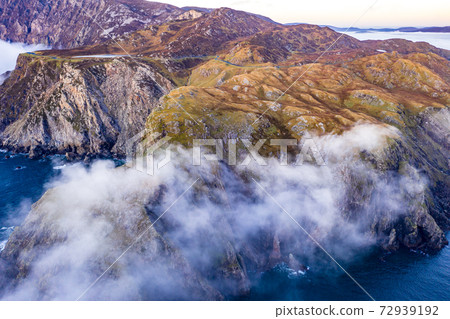 Dramatic aerial view of the Slieve League cliffs in County Donegal, Ireland Dramatic aerial view of the Slieve League cliffs in County Donegal, Ireland 72939192