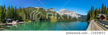 Emerald Lake panorama view. Canoe Rentals Boathouse, Lake Lodge, conference centre along lakeside and Michael Peak in the background. Yoho National Park, Canadian Rockies, BC, Canada Emerald Lake panorama view. Canoe Rentals Boathouse, Lake Lodge, conference centre along lakeside and Michael Peak in the background. Yoho National Park, Canadian Rockies, BC, Canada 72939655