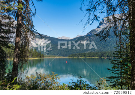 Emerald Lake in summer sunny day with Mountains in the background. Yoho National Park, Canadian Rockies, British Columbia, Canada. Emerald Lake in summer sunny day with Mountains in the background. Yoho National Park, Canadian Rockies, British Columbia, Canada. 72939812
