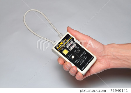 Hand installer keeps Ethernet LAN tester Hand installer keeps Ethernet LAN tester 72940141