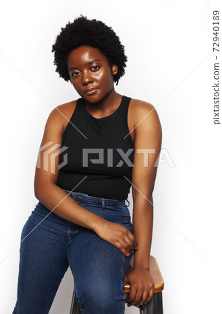 young pretty african american woman with natural makeup posing emotional isolated on white background, lifestyle people concept young pretty african american woman with natural makeup posing emotional isolated on white background, lifestyle people concept 72940189
