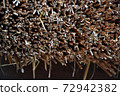 yellow and brown straw, part of the roof a thatched house in Sweden 72942382