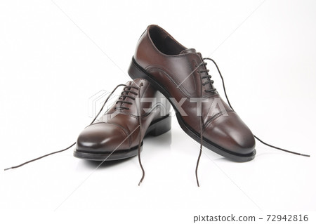 Classic men's brown shoes on white background 72942816