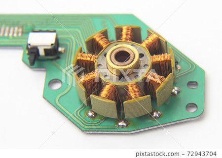 rotor of a small electric motor close up. electrical engineering industry 72943704