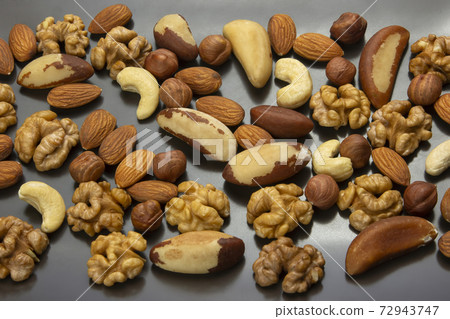 Different kinds of nuts. Healthy and protein food Different kinds of nuts. Healthy and protein food 72943747